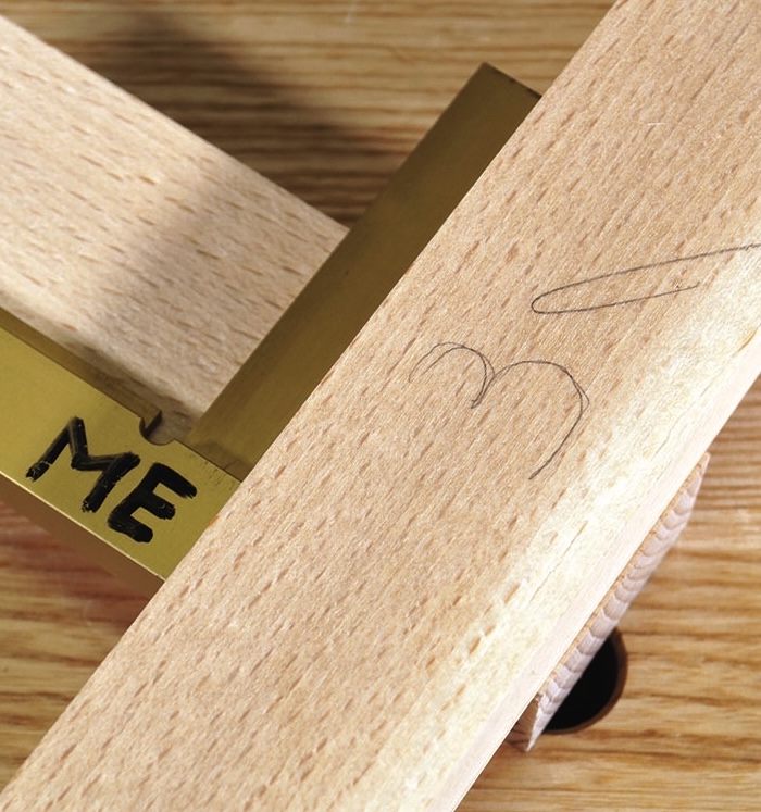 Handmade wooden crafting tool on table.