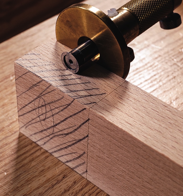 Marking gauge on wooden dovetail joint
