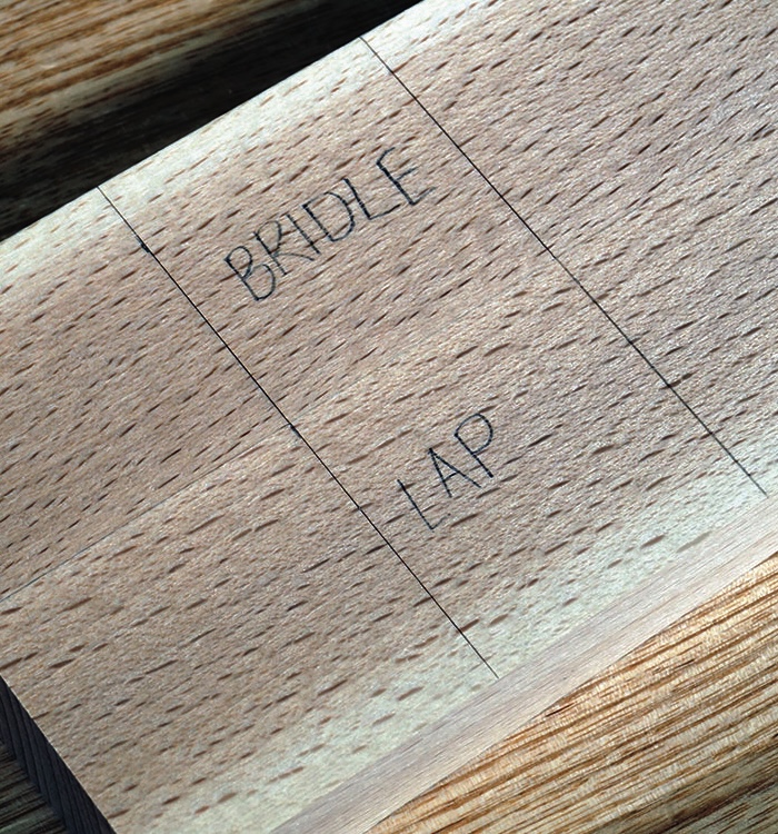 Wood carving layout with bridle and lap joints.