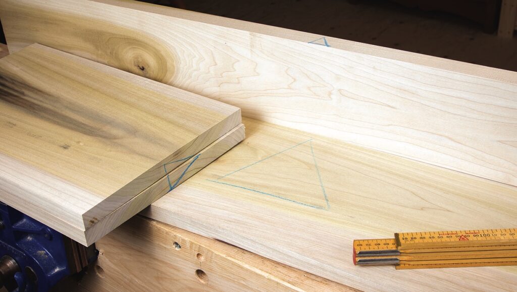 Woodworking: marked planks and measuring tool.