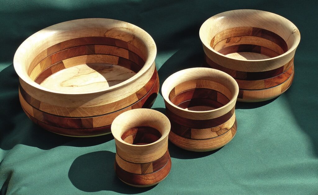 Set of wooden bowls with unique patterns.