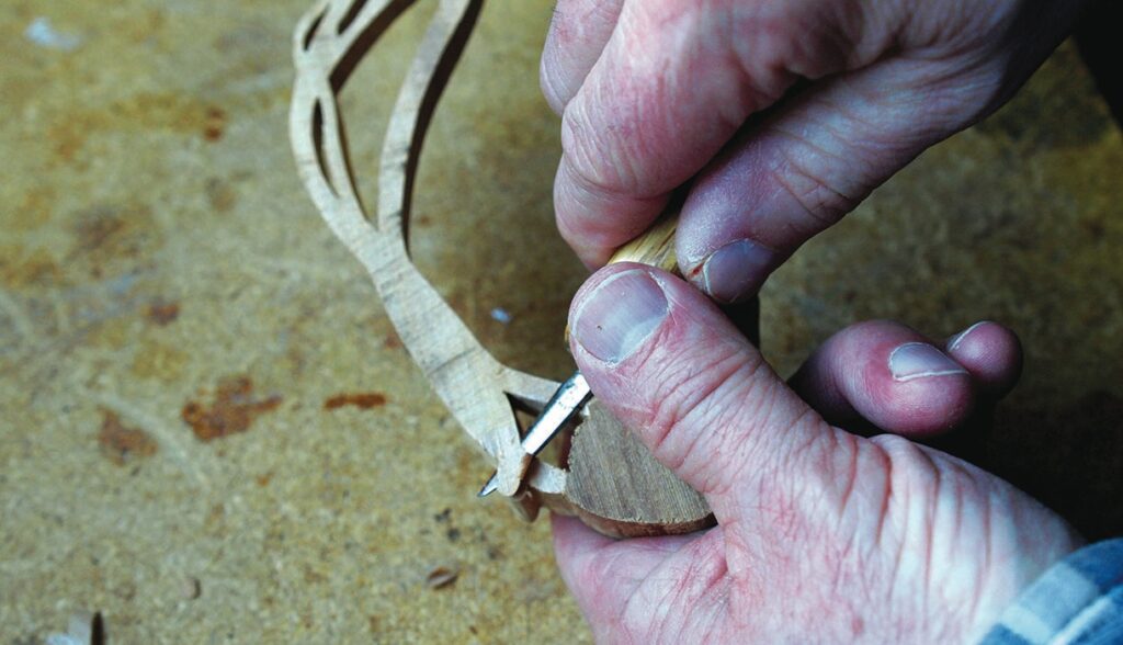 Hand carving detailed wooden sculpture close-up