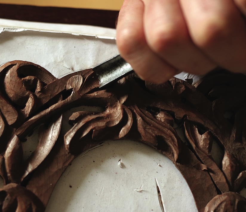 Close-up of woodcarving with hand tool.