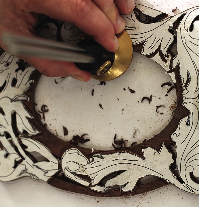 Close-up of intricate wood carving in progress
