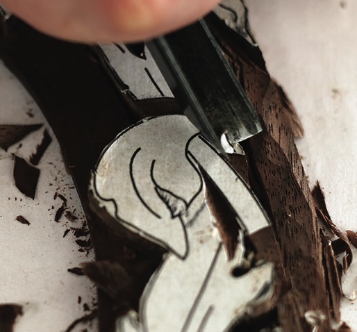 Linocut carving on woodblock art project