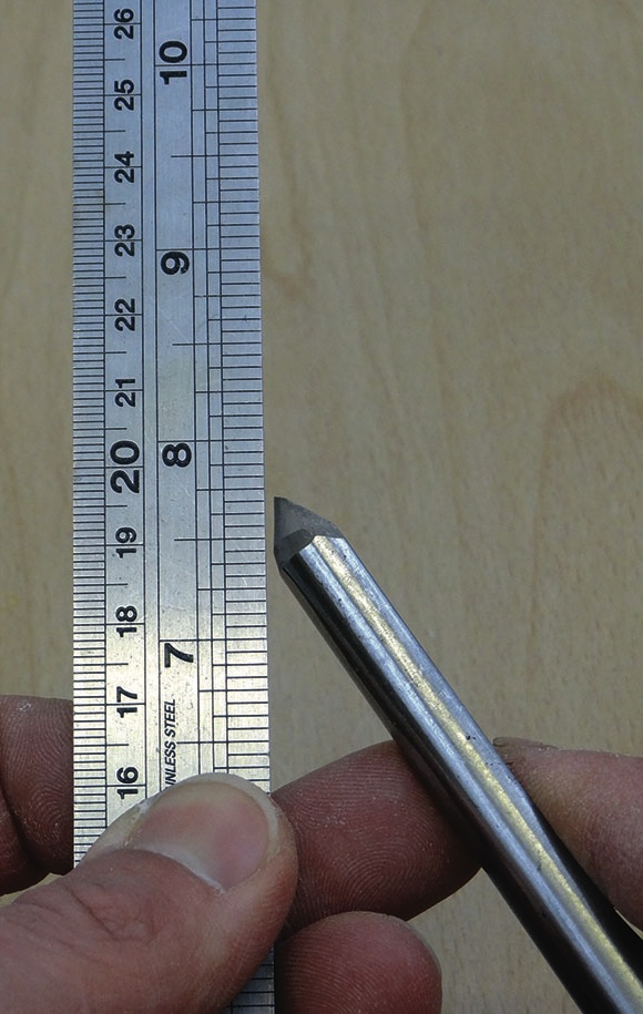 Measuring carbide-tipped scribe with a ruler scale.