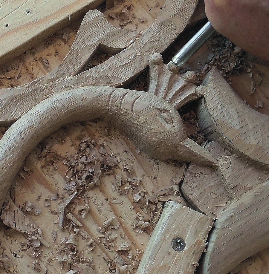 Close-up of intricate wood carving in progress.