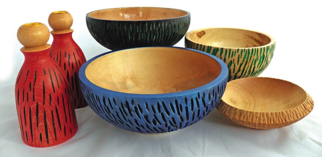 Colourful carved wooden bowls and bottles.