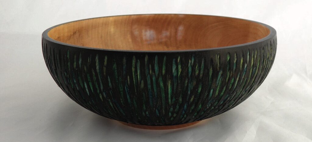 Handcrafted decorative wooden bowl with intricate design