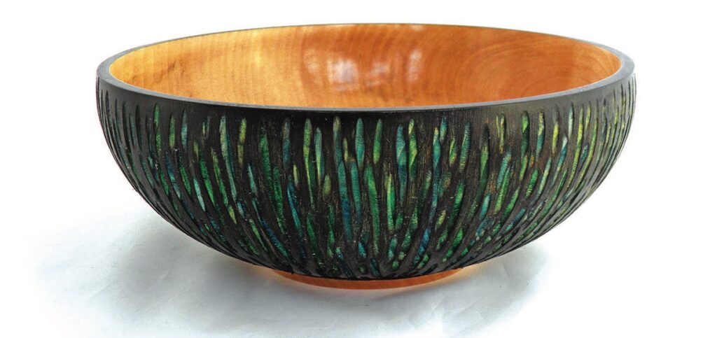 Decorative wooden bowl with carved exterior design.