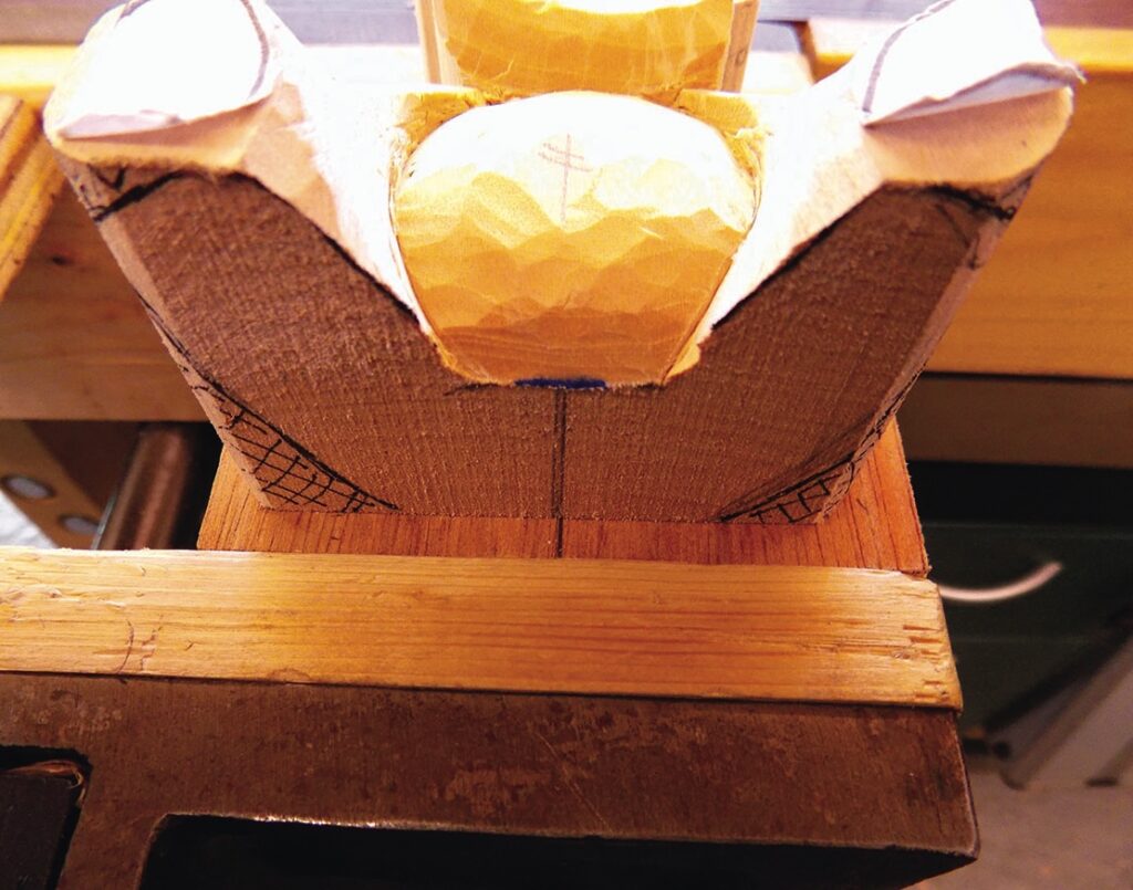 Wooden carving in a vice, work in progress.