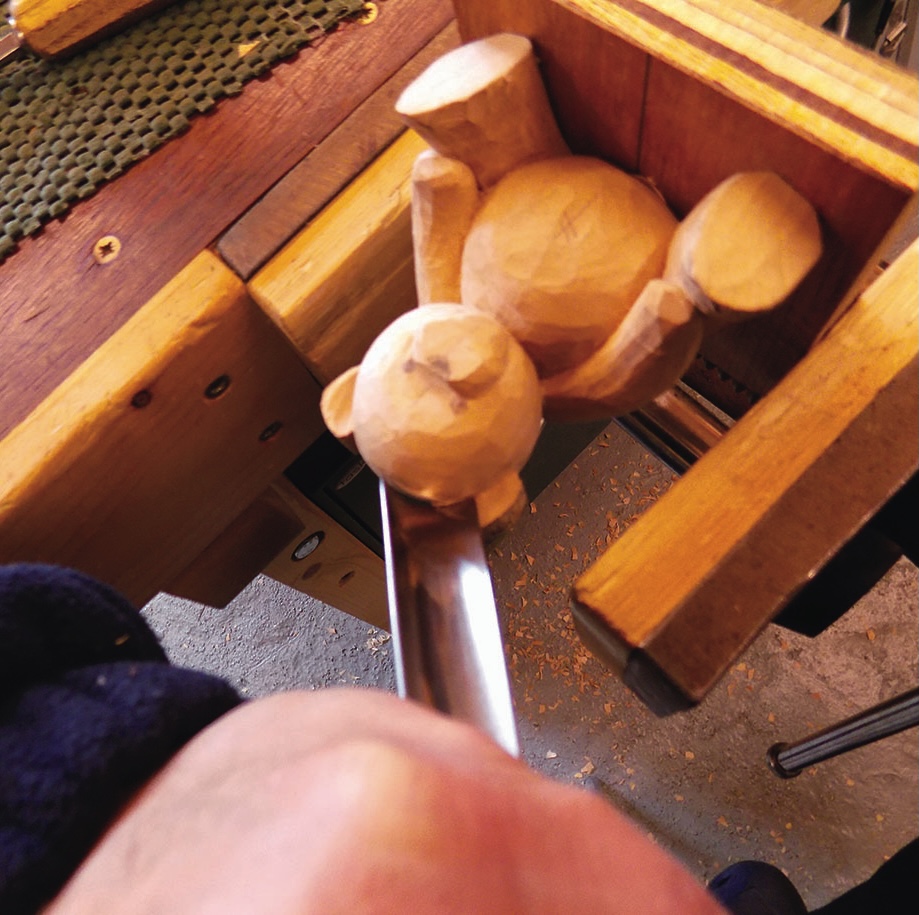 Wood carving of a bear in progress