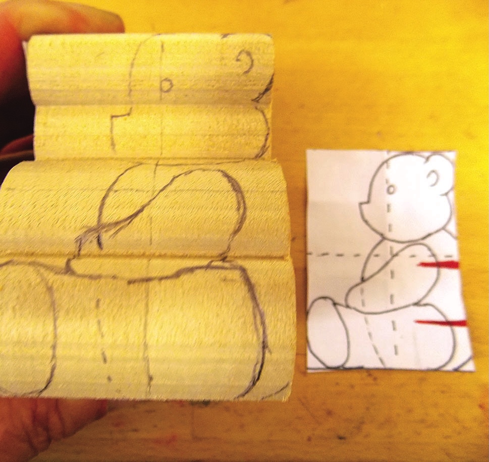 Wood carving outline beside teddy bear template.