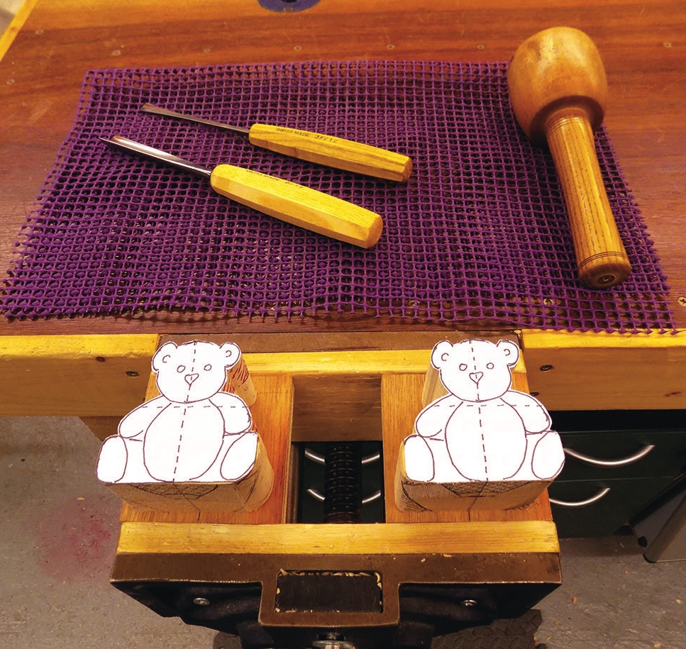 Woodworking tools and bear patterns on workbench