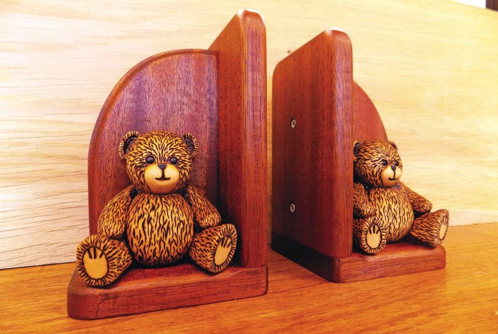 Wooden bear bookends on a shelf