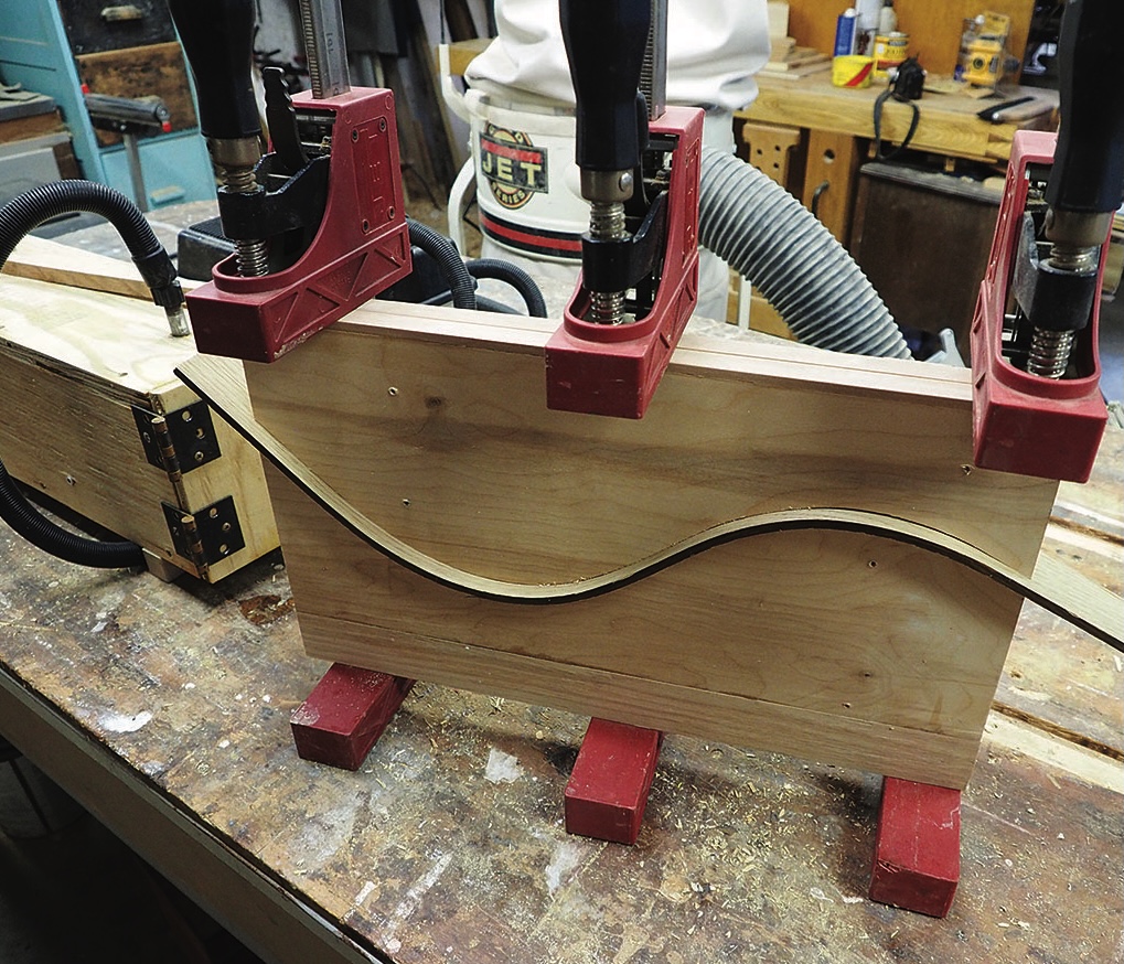 Wood glueing with clamps on a workbench