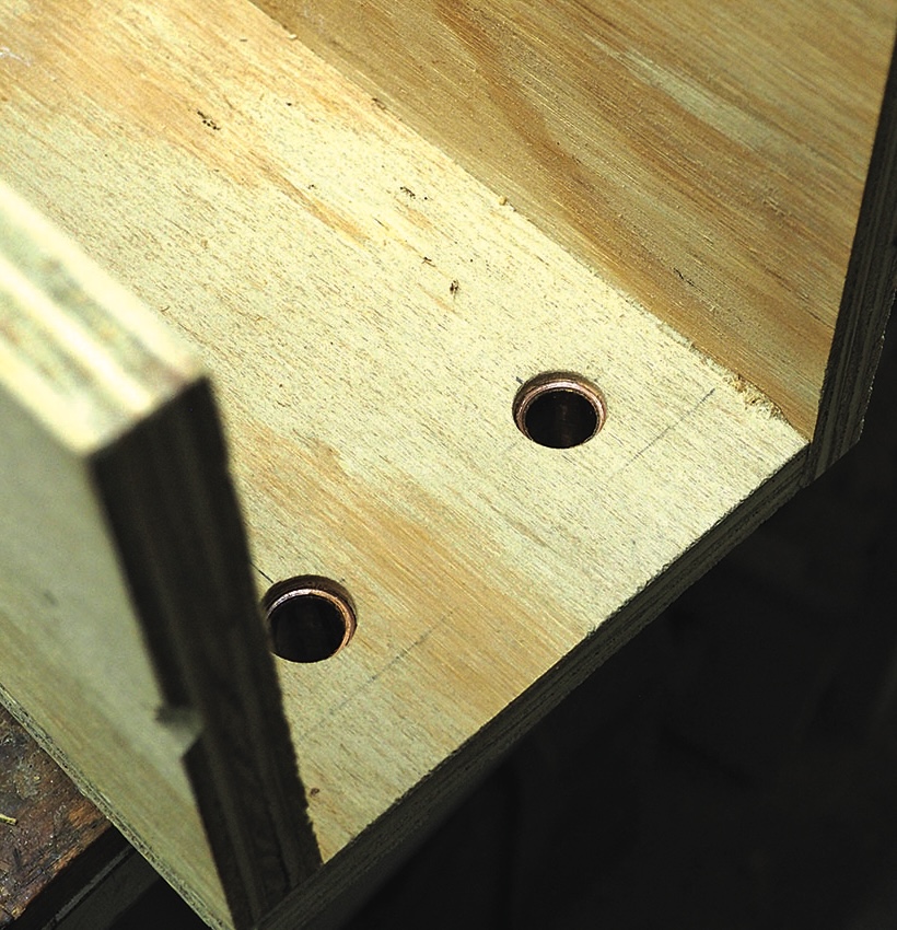 Close-up of drilled plywood with holes