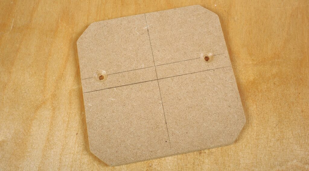 Wooden board with grid markings and holes