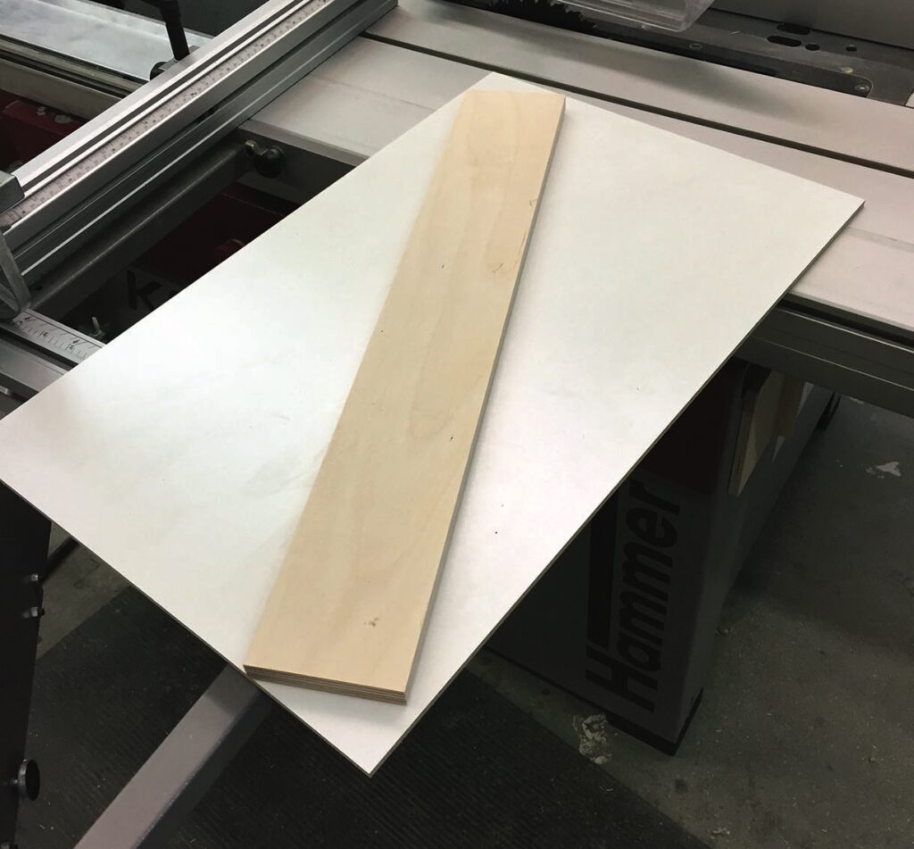Wooden panel on a table saw.