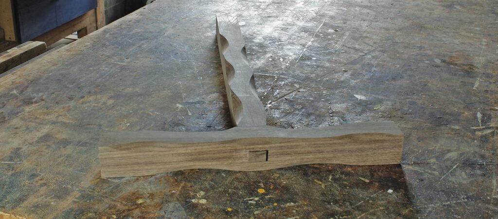 Wooden woodworking joint on workbench.