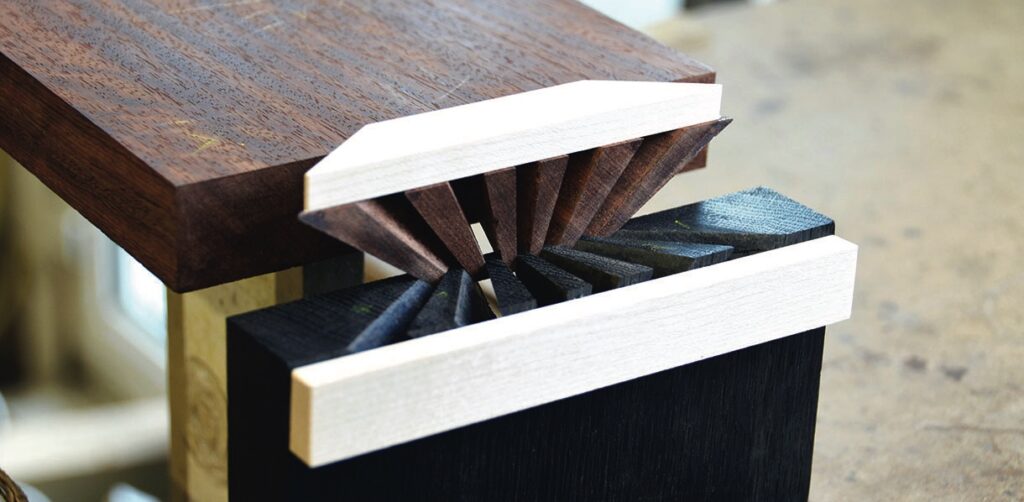 Intricate wooden joint in furniture construction.