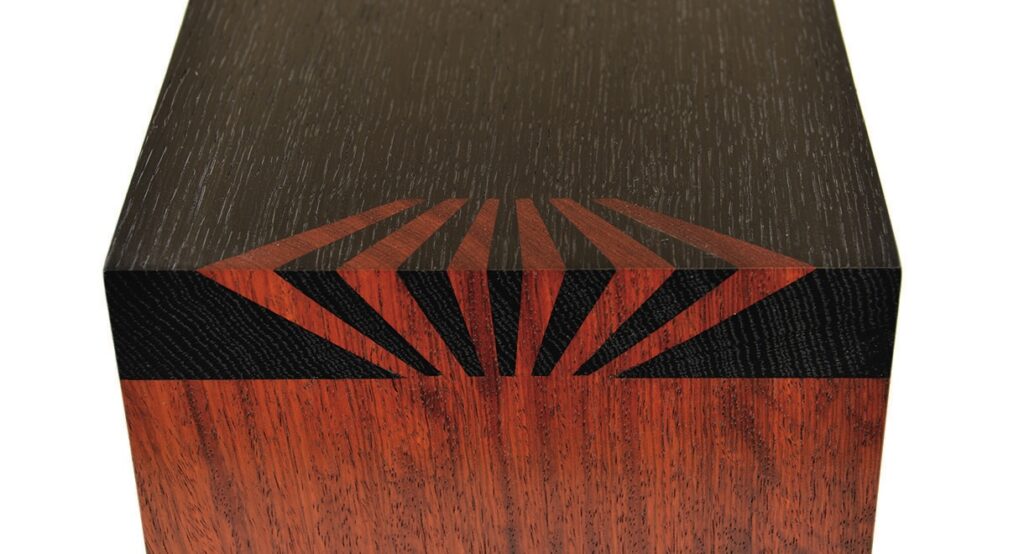 Wooden box with decorative geometric inlay pattern