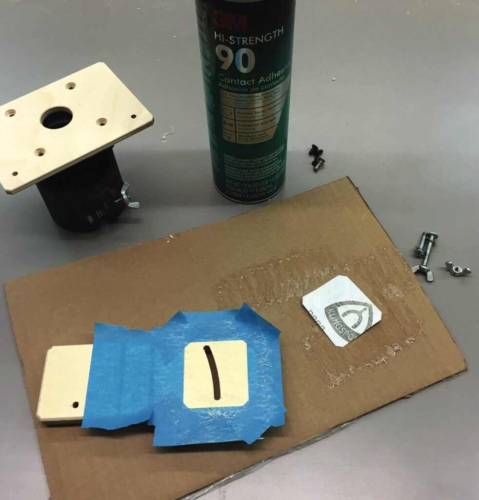 Workshop materials with adhesive and mounting hardware.