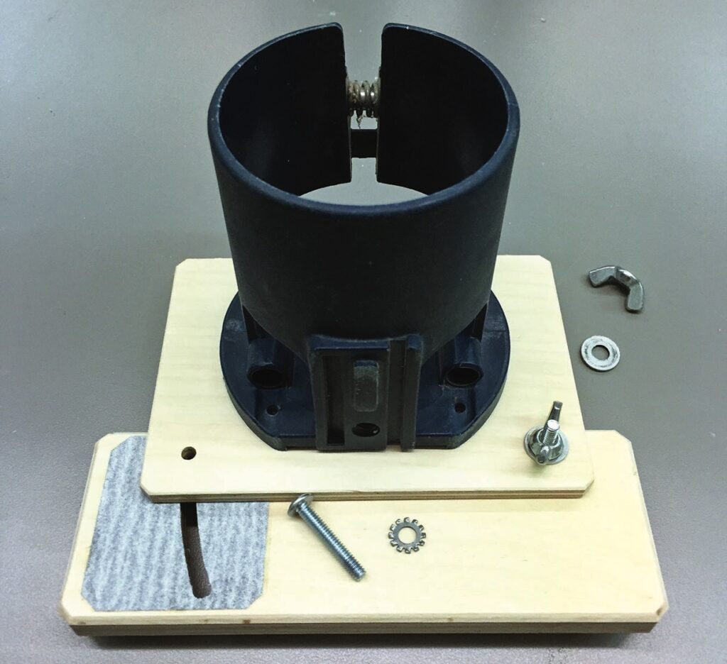 Router mount with screws and hardware parts.