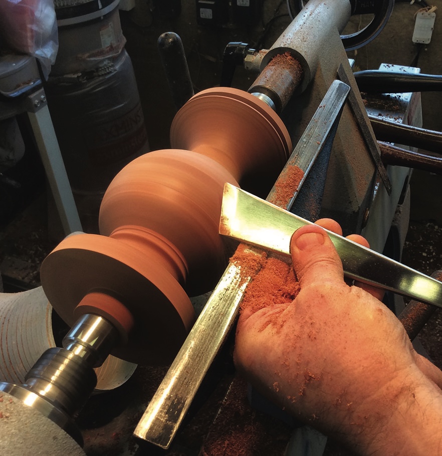 Woodturning spindle on a lathe.