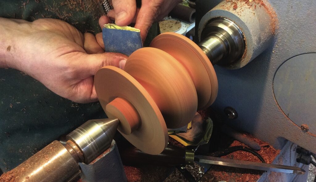 Woodturning craft on a lathe in workshop