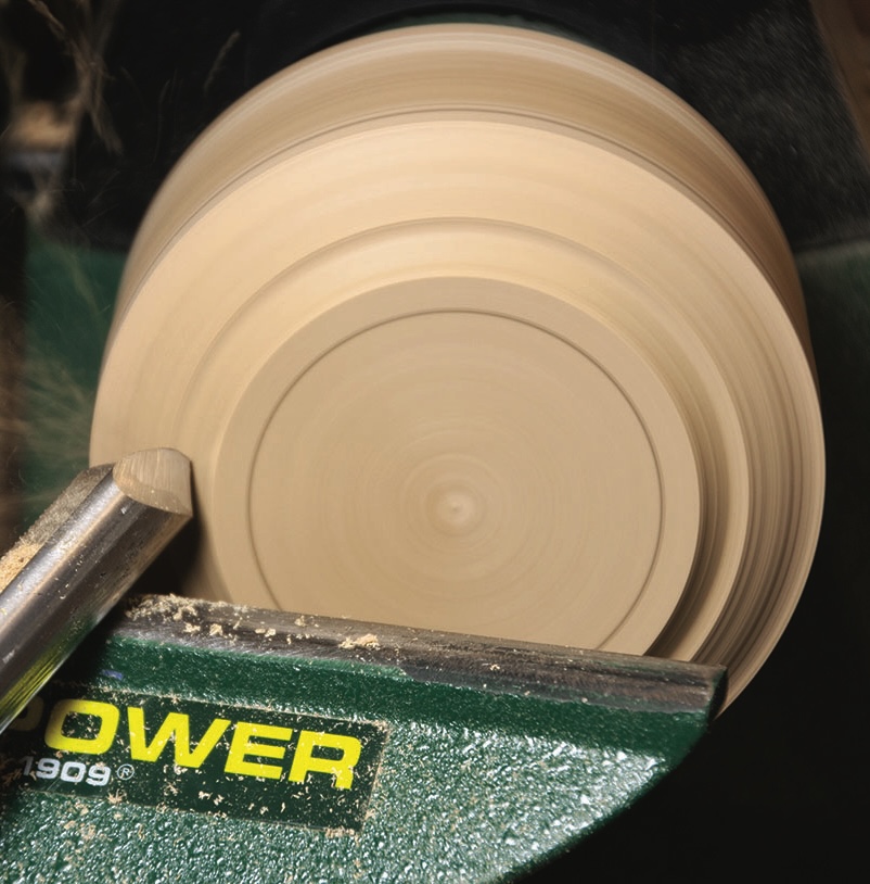 Woodturning process with lathe and chisel