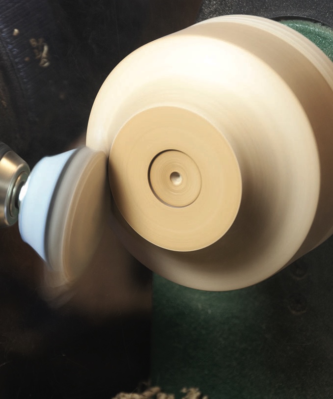 Wood lathe crafting a spinning wooden bowl