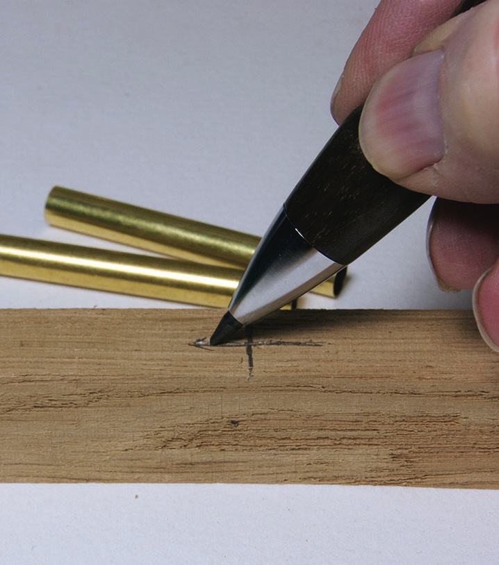 Drawing on wood with a mechanical pencil.