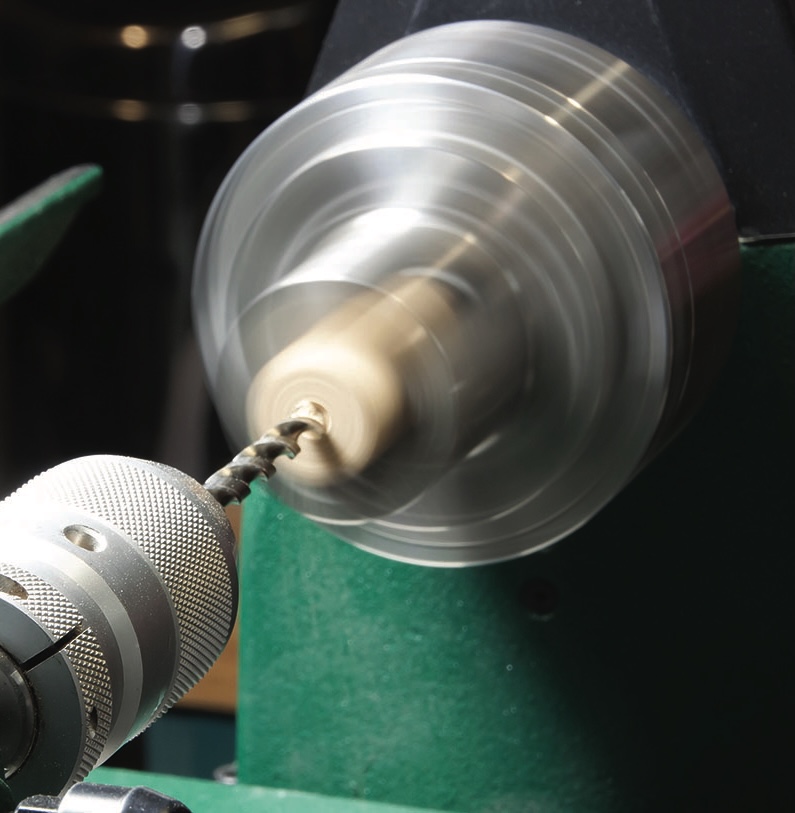Spinning drill on a lathe machine