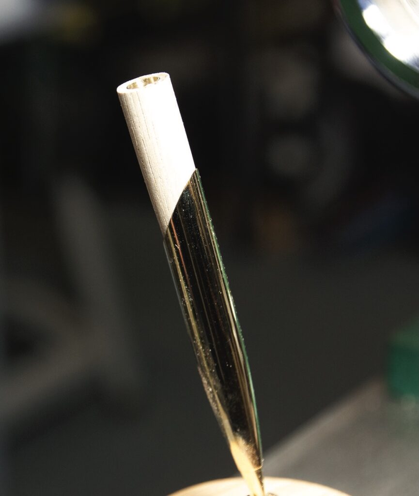 Close-up of a golden pen nib.