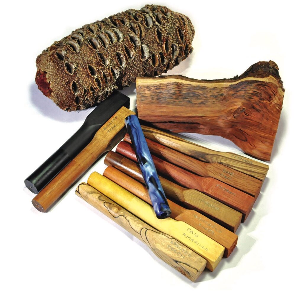 Assorted wood and decorative pen blanks on display.