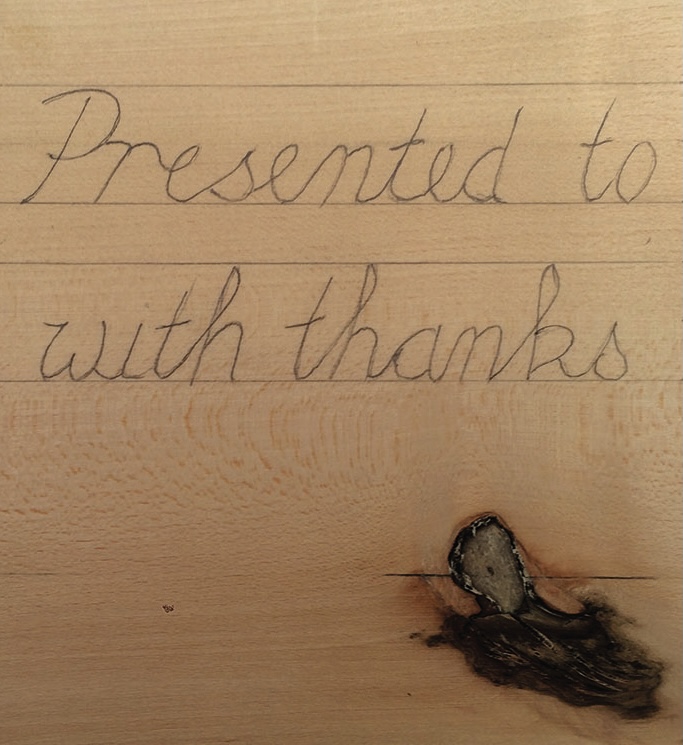 Wood plaque with engraving 'Presented to with thanks'.
