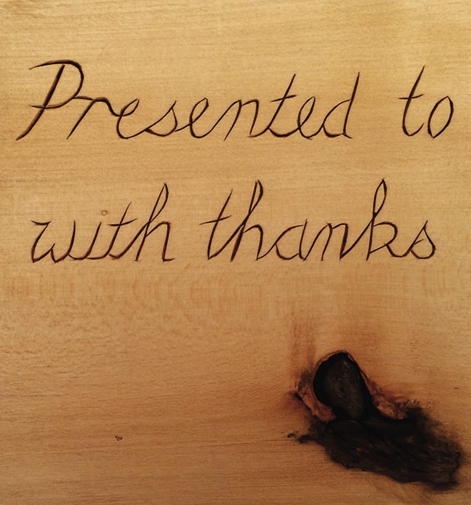 Wood plaque with thank you message engraved.