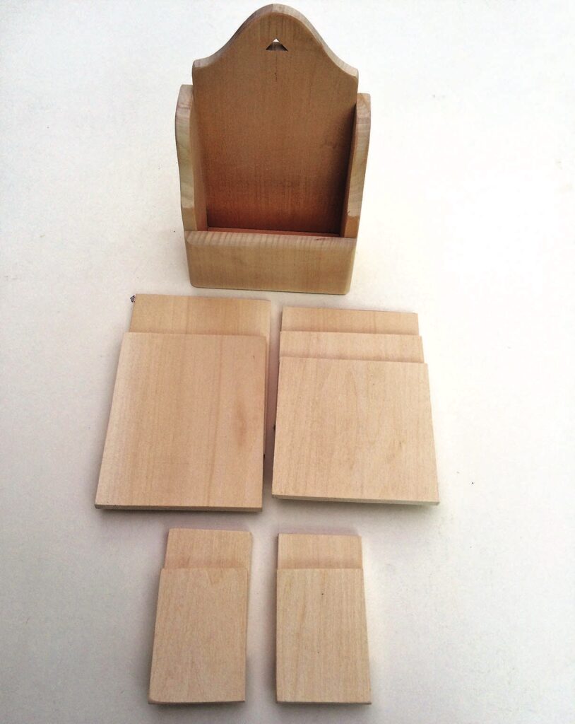 Wooden letter holder with separate wooden pieces