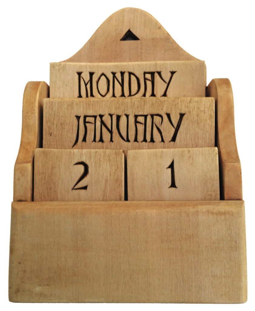 Wooden calendar showing Monday, January 21.