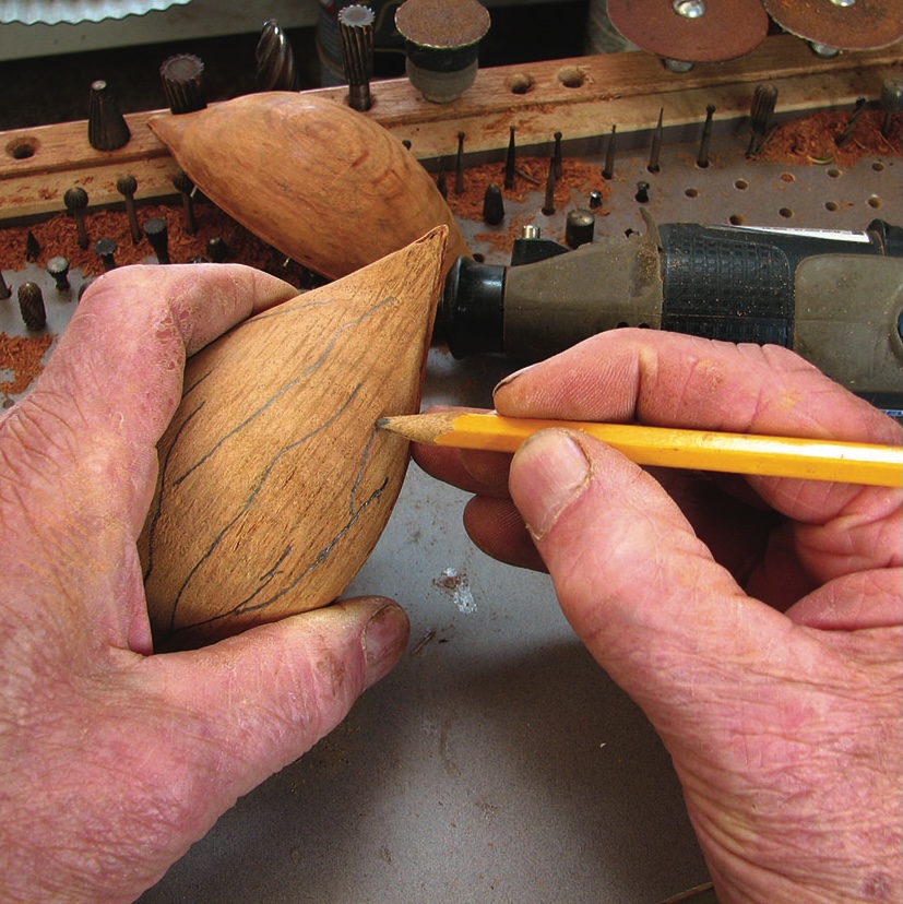 Person crafting wood with precision tools and pencil.