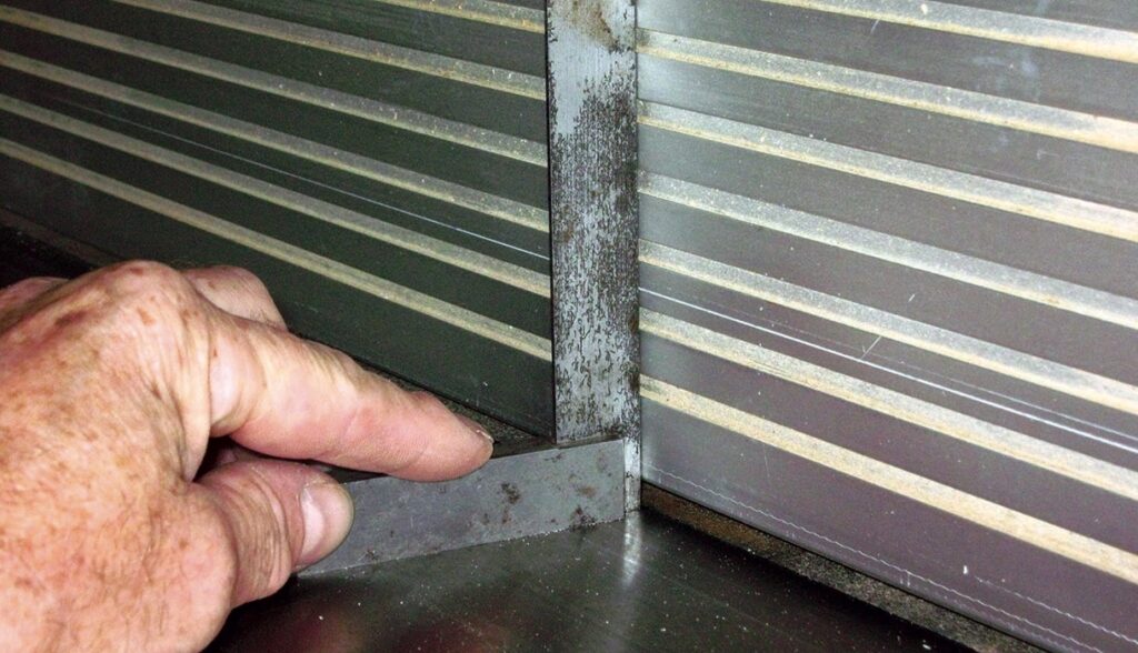 Checking metal alignment with engineers square tool