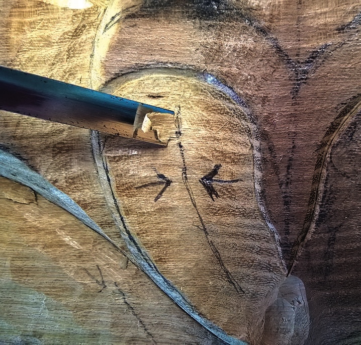 Close-up of wood carving tool in action