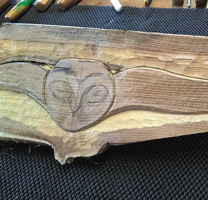 Wooden carving of an owl in progress