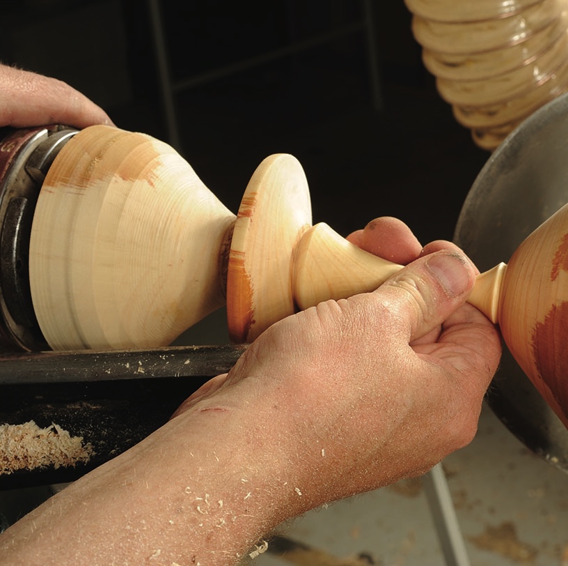 Woodturning process on a lathe machine