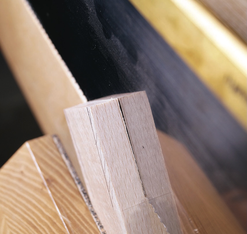 Close-up of wooden dovetail joint construction.