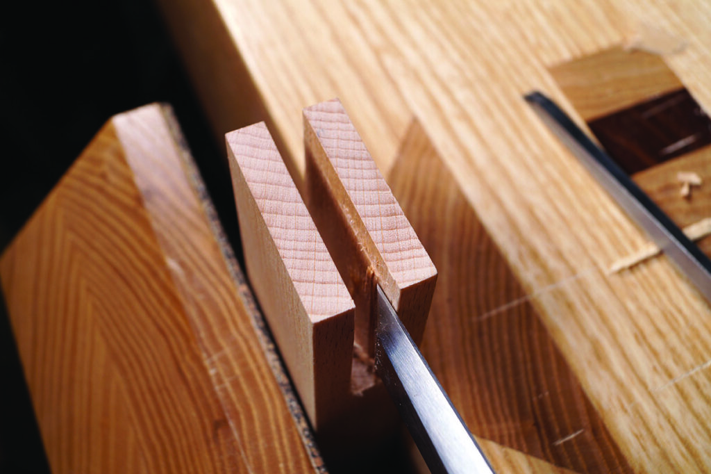 Woodworking with chisel and dovetail joint