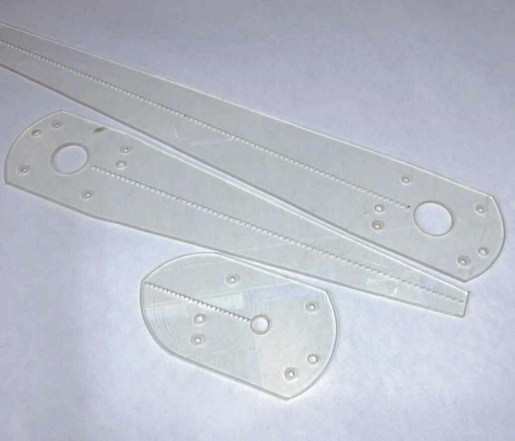 Clear plastic drawing templates on white background