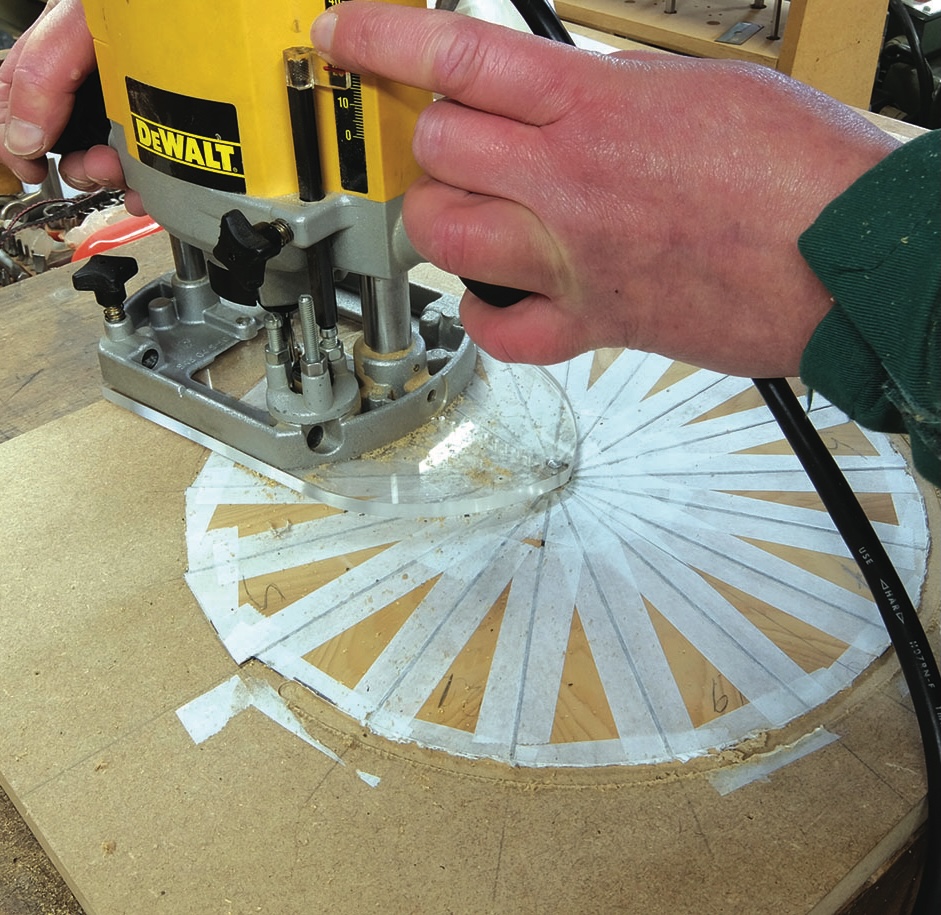 Person using router for precise wood carving.