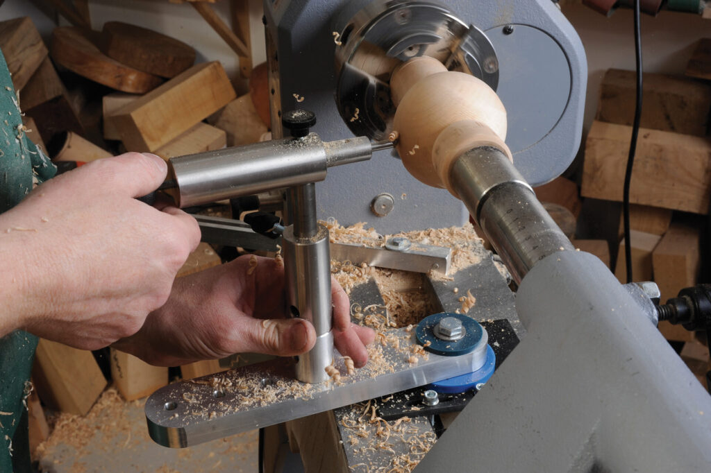 Woodturning on lathe, creating wooden object.